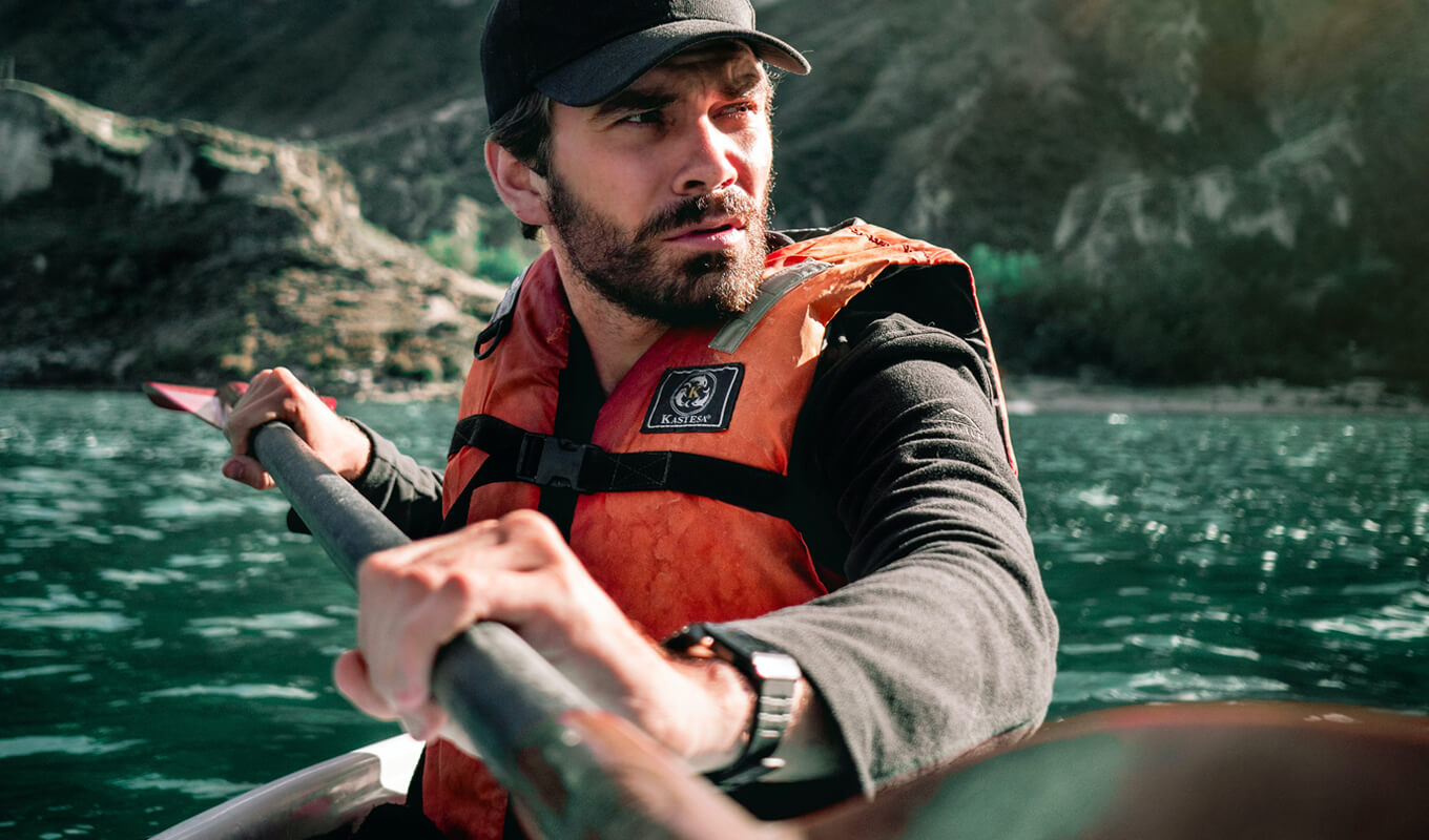 Man wearing a wetsuit and life jacket