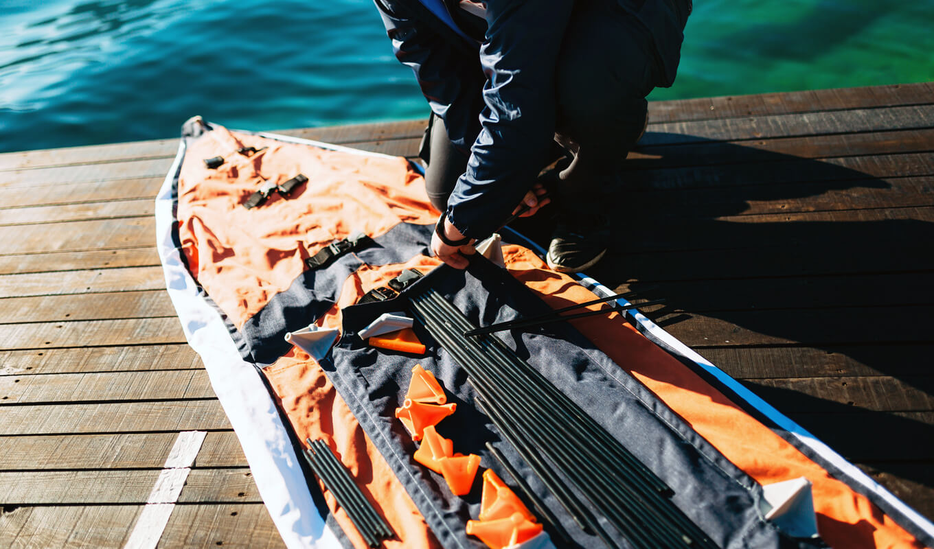 Man assembling a folding kayak