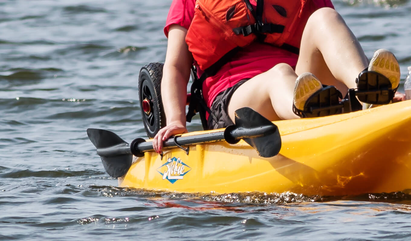 Kayak paddle hang on a yellow kayak
