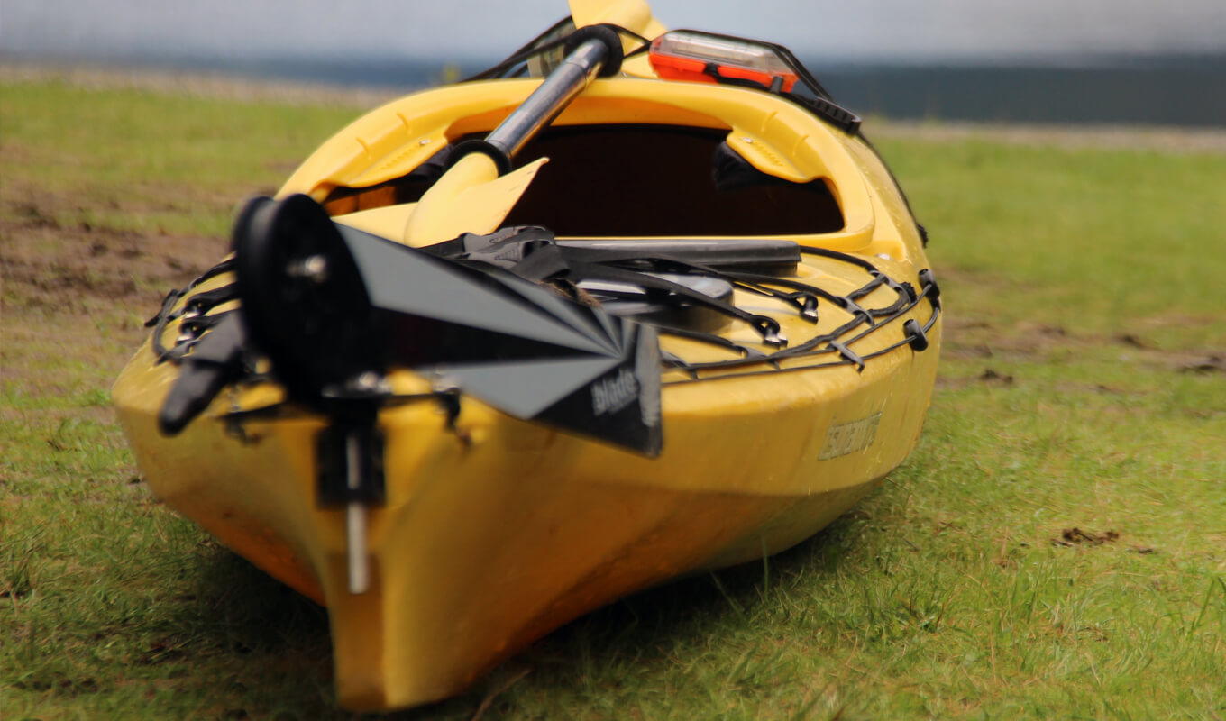 Yellow kayak with a rudder