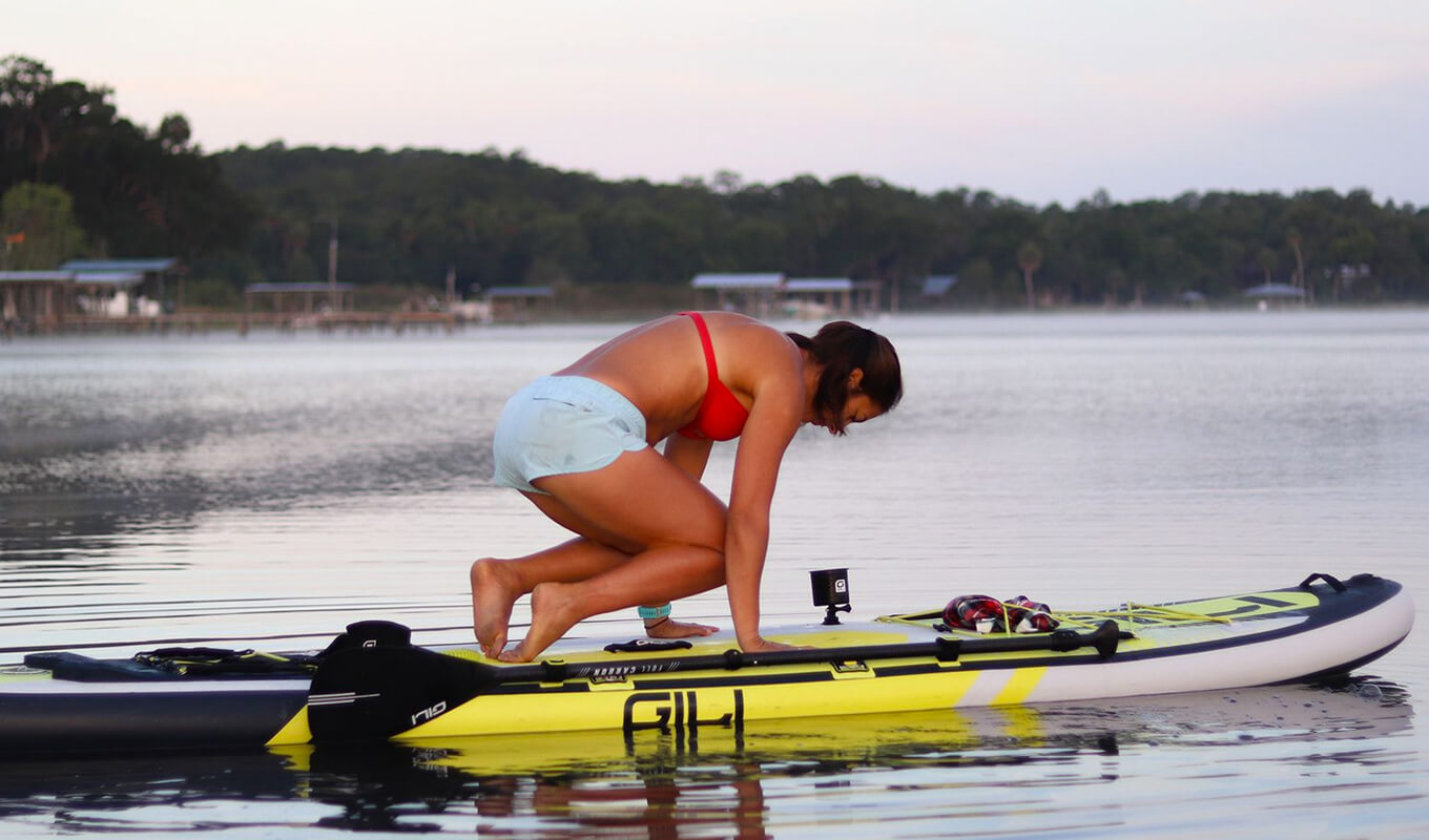 Woman doing a yoga on her GILI sup