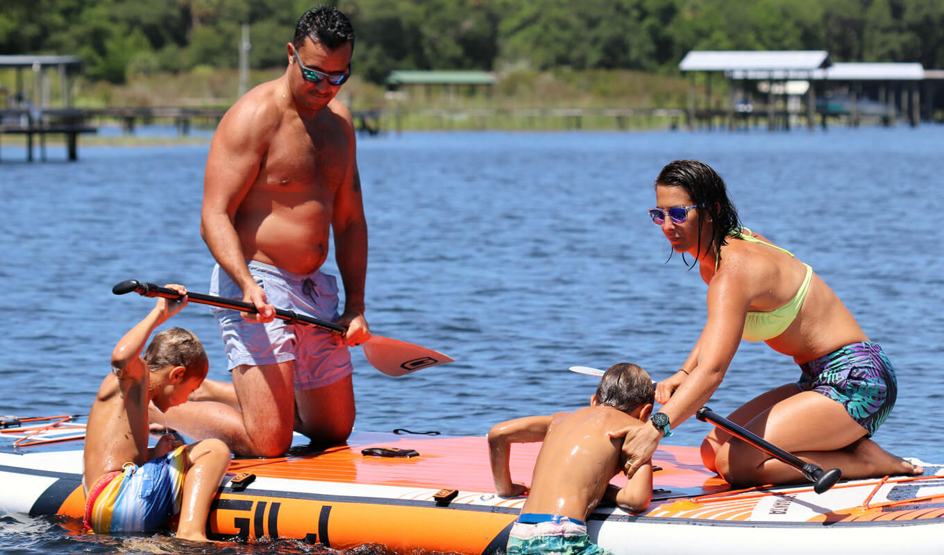 Parents helping their children to get on board