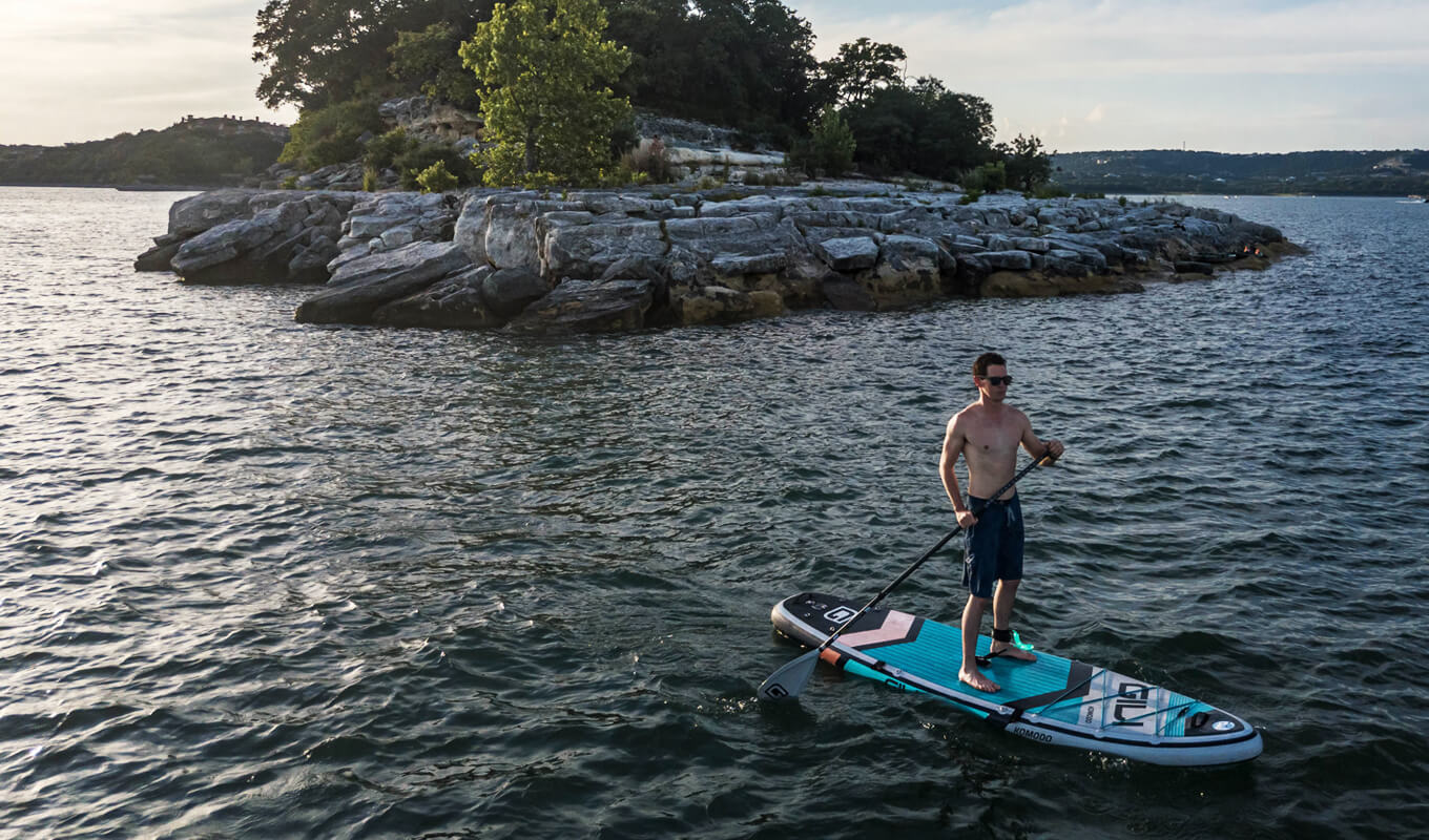Man paddle boarding on ocean with currents and rips