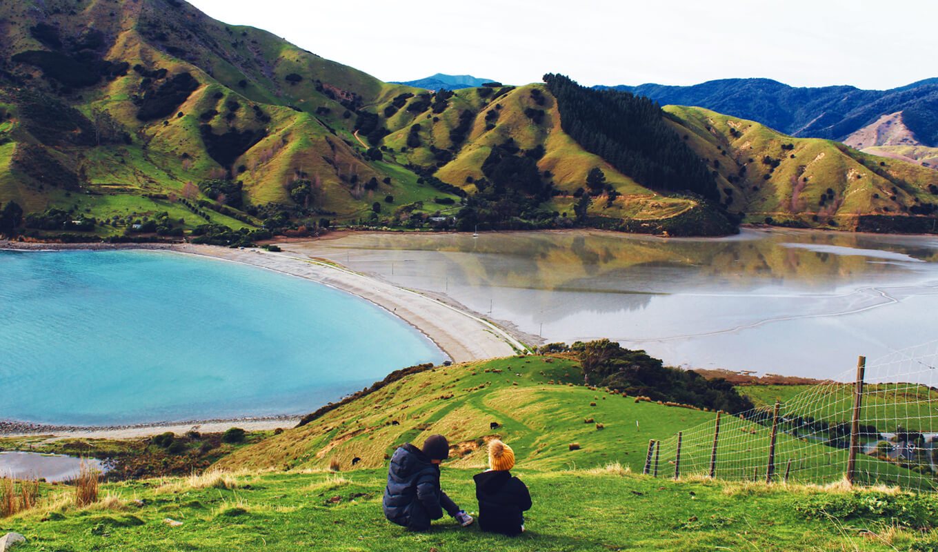Man and a woman sitting on the mountain