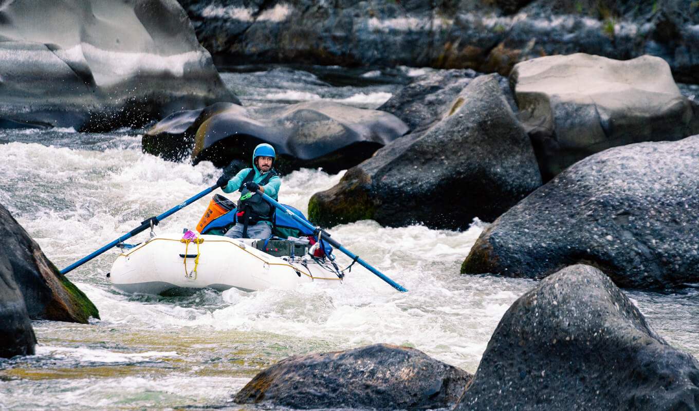 Man whitewater rafting