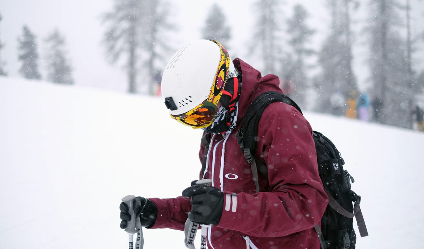 Man snowboarding wearing a red jacket