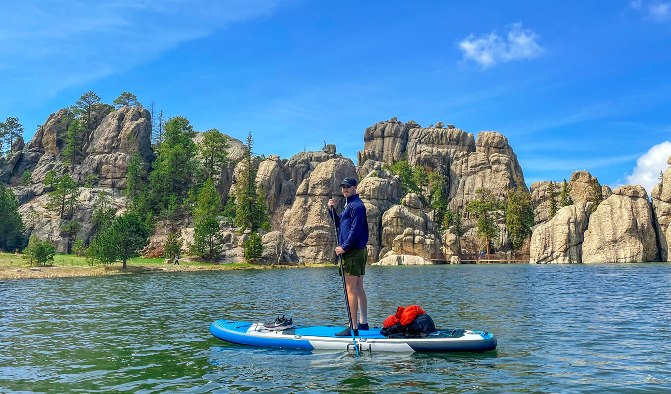 Man SUP fishing with light equipments using a GILI Air