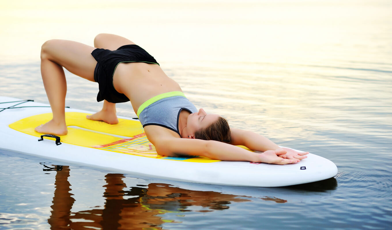 Woman performing a yoga bridge pose