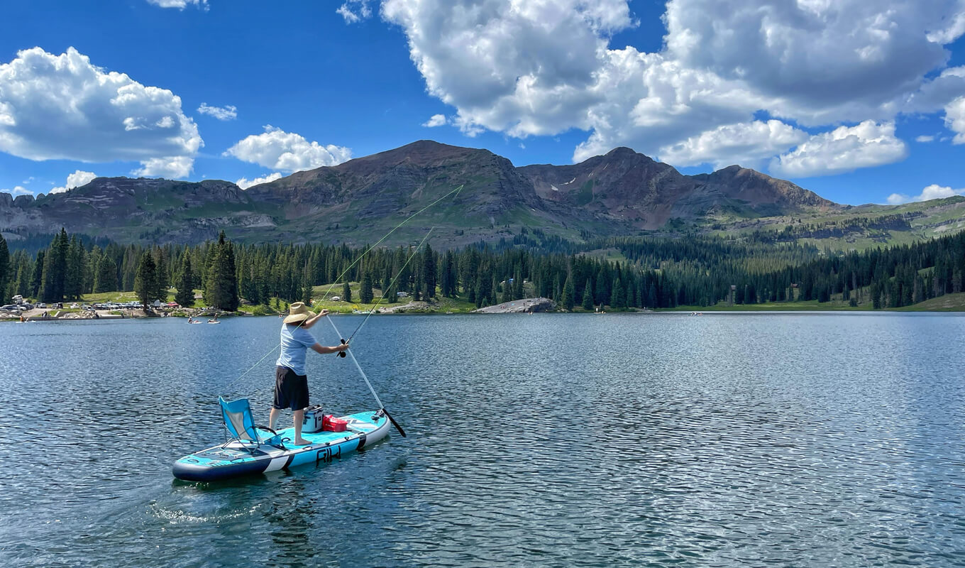 Man fishing on a manta inflatable paddle board