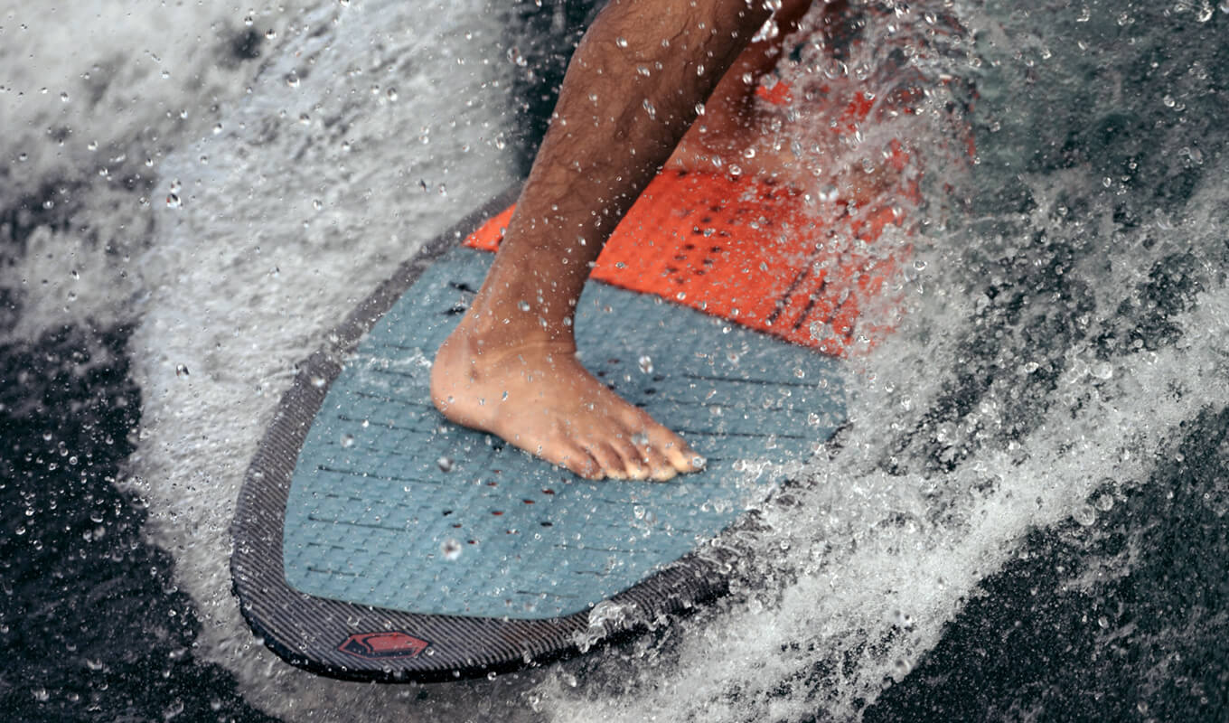 A person riding a surf board on a wave