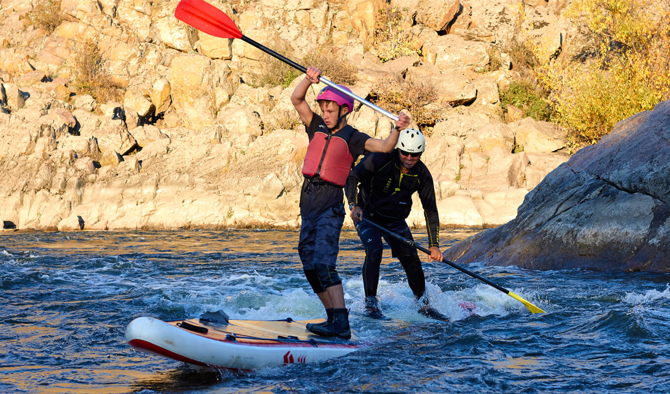 Man paddle boarding on a river