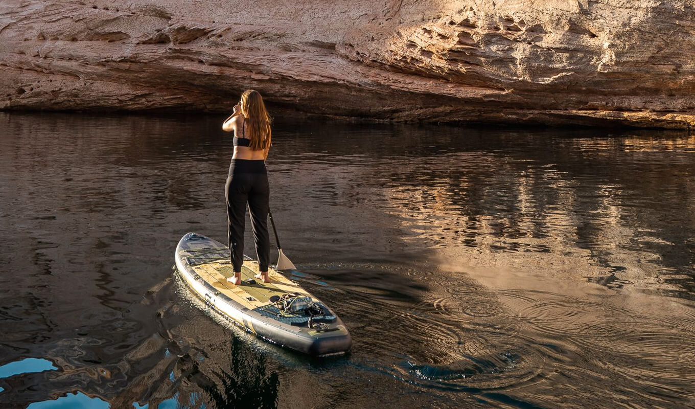 Woman paddle boarding in Lake powell using GILI Camo